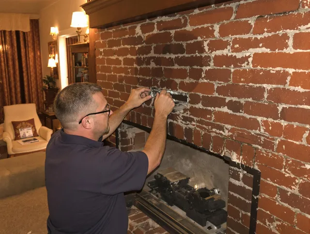 La Mirada Chimney Sweep expert fixing a fireplace in La Mirada, CA